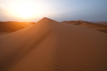 Fototapeta na wymiar The beauty of the sand dunes in the Sahara Desert in Morocco. The Sahara Desert is the largest hot desert and one of the harshest environments in the world.