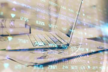 Forex market graph hologram and personal computer on background. Double exposure. Concept of investment.