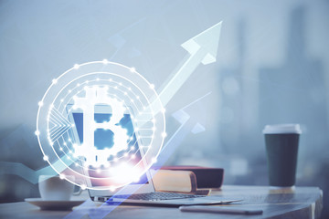 Multi exposure of blockchain theme hologram and table with computer background. Concept of bitcoin...