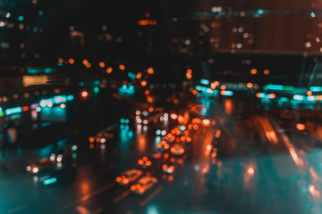 Defocused urban abstract city lights at night, colorful bokeh. Abstract auto, city street, traffic,...