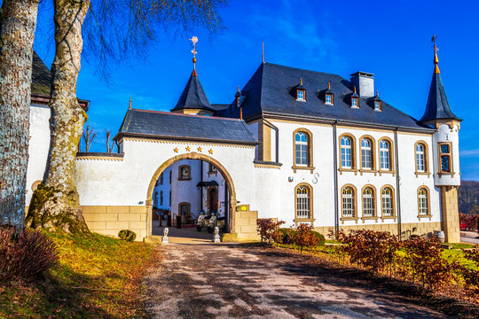 Urspelt Castle in Urspelt, Grand Duchy of Luxembourg, now converted into a hotel, exterior street view