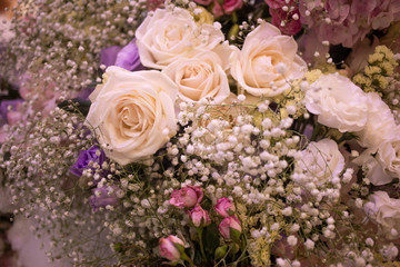 Obraz na płótnie Canvas Soft cream white bouquet of rose decorating in wedding event