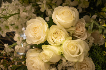Fototapeta na wymiar Soft cream white bouquet of rose decorating in wedding event
