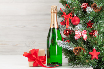 Christmas card with fir tree, champagne and gift