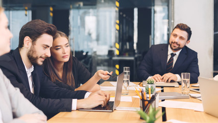 Young business team discussing new ideas in office