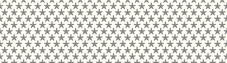 Seamless texture with hand drawn snowflakes. Vector.