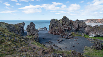 Volcanic lava rocks at Djupalonssandur beach in Snaefellsnes peninsula in Western Iceland