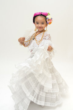 Little Mexican dancer girl dressed in a traditional folk costume of the state of Veracruz Mexico