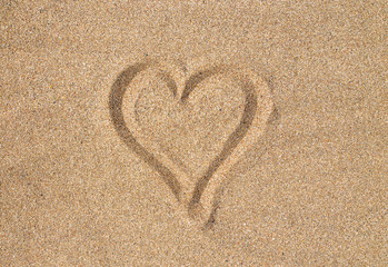 Heart sign on the sand on the beach