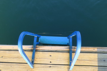 Blue Ladder On Wooden Dock