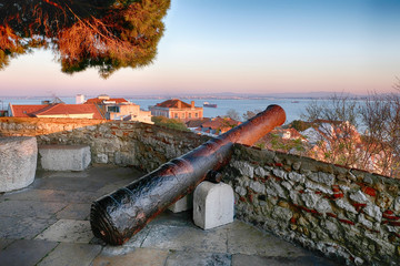  old cannon on high stone walls castle of Saint George Castle  the City of Lisbon in Portugal  ...