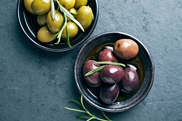 Whole green and black olives in olive oil. Flat lay. Copy space. Mediterranean cuisine - 302031380