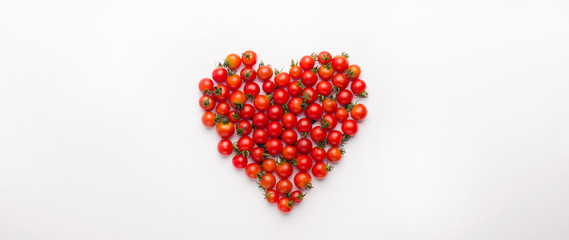 Heart shaped cherry tomatoes isolated on white