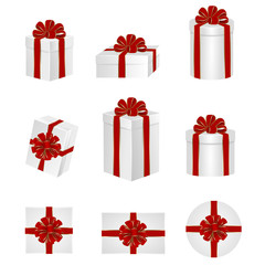 set white gift boxes with red bows and ribbons