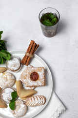 Traditional tea with mint and assorted Arab sweets