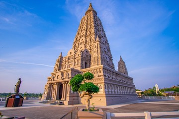 Naklejka premium Mahabodhi Temple or Bodh Gaya Pagoda at Wat-Panyanantaram sunrise and beautiful sky, Wat Panyanantaram is famous pagoda and popular for traveler near bangkok at Pathum Thani, Thailand