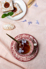 Traditional tea with mint and assorted Arab sweets