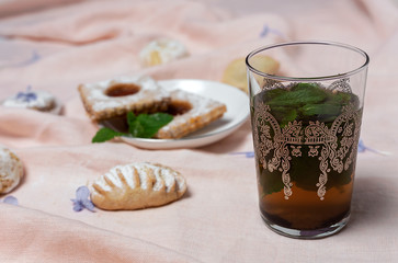 Traditional tea with mint and assorted Arab sweets