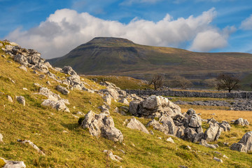 Fototapeta na wymiar Ingleborough is the second-highest mountain in the Yorkshire Dales. It is one of the Yorkshire Three Peaks, the other two being Whernside and Pen-y-ghent.