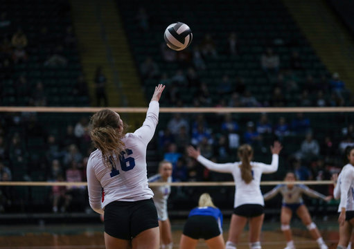 A Young Woman Follows Through On A Serve