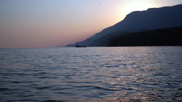 sunset and waves on aegean coas