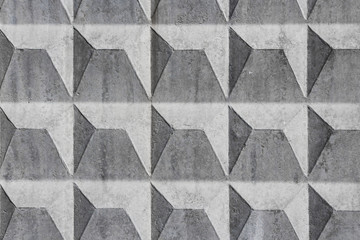 Beautiful horizontal texture of part of gray concrete corrugated wall with holes for construction