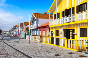 Street with colorful houses in Costa Nova, Aveiro, Portugal. Street with striped houses, Costa...