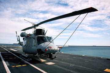 Helicopter on the deck of the ship Juan Carlos I (L-61), an amphibious assault ship of greater size...