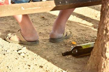 Male alcoholic with a bottle. The disposition of alcoholism. The problem is in the family.