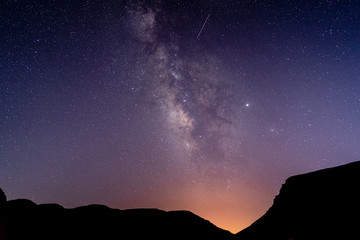 Milky Way with Shooting Star and Mountains as Foreground in Morocco