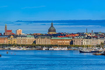 Panoramic view of the boulevard Strandvägen in Östermalm from Saltsjön bay with various touristic sightseeing boats, yachts, ferry  and ships in Stockholm, Sweden.