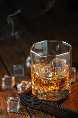 Whiskey in glass with ice