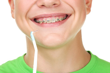 Naklejka premium Young man with toothbrush on white background