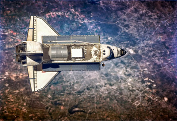 Space shuttle take off in the space from Earth. Stars and Planet on background. Atmosphere. Elements of this image furnished by NASA