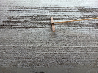 Scraping the surface of the concrete road To create friction between the concrete surface and the...