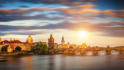 Fototapeta premium Charles Bridge (Karluv Most) and Lesser Town Tower, Prague in summer at sunset, Czech Republic