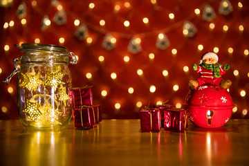 Christmas fairy lights in a mason jar, glowing in the dark, fairy lights in mason jar with selective focus, glitter overlay