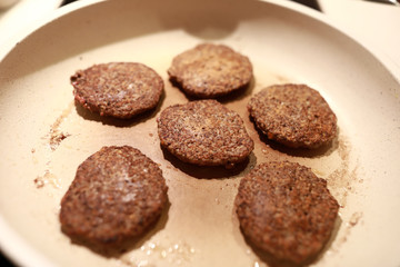 Frying liver patties in pan