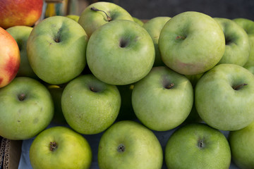 Apples on the counter for sale