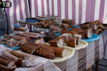 Fototapeta na wymiar Smoked meat and sausages for sale