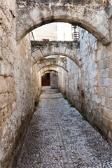 Fototapeta na wymiar A narrow street in Rhodes.