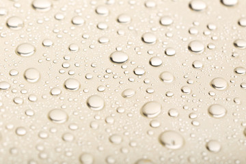 Water drops on beige background