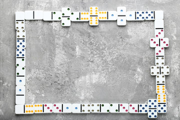 Dominoes on grey wooden table