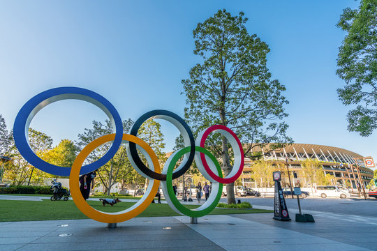 TOKYO, JAPAN - November 1,2019 : The five ring symbol of the Olympic Games at tokyo museum and new stadium in background. Japan will host the Tokyo 2020 summer olympics and Paralympic.