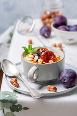 Millet porridge with hazelnuts, caramelized plums and cinnamon.