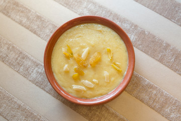 Nawabi food - Bowl of ferni created by milk and best quality rice.