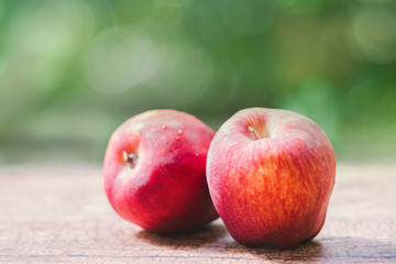 Fototapeta na wymiar Fresh red apples in wooden background
