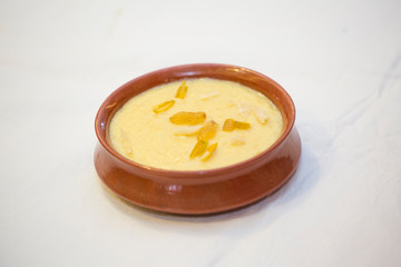 Nawabi food - Bowl of ferni created by milk and best quality rice.