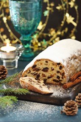 Stollen. Traditional German Christmas cake Stollen on wooden background.