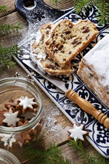 Stollen. Traditional German Christmas cake Stollen on wooden background.